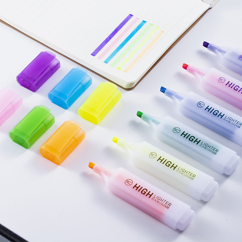 Chisel tip highlighters with sample strokes on paper