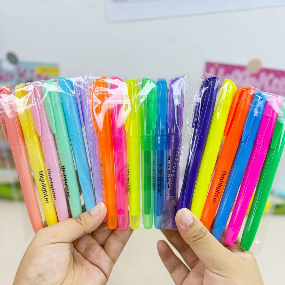 Slim chisel highlighter packs held in hand
