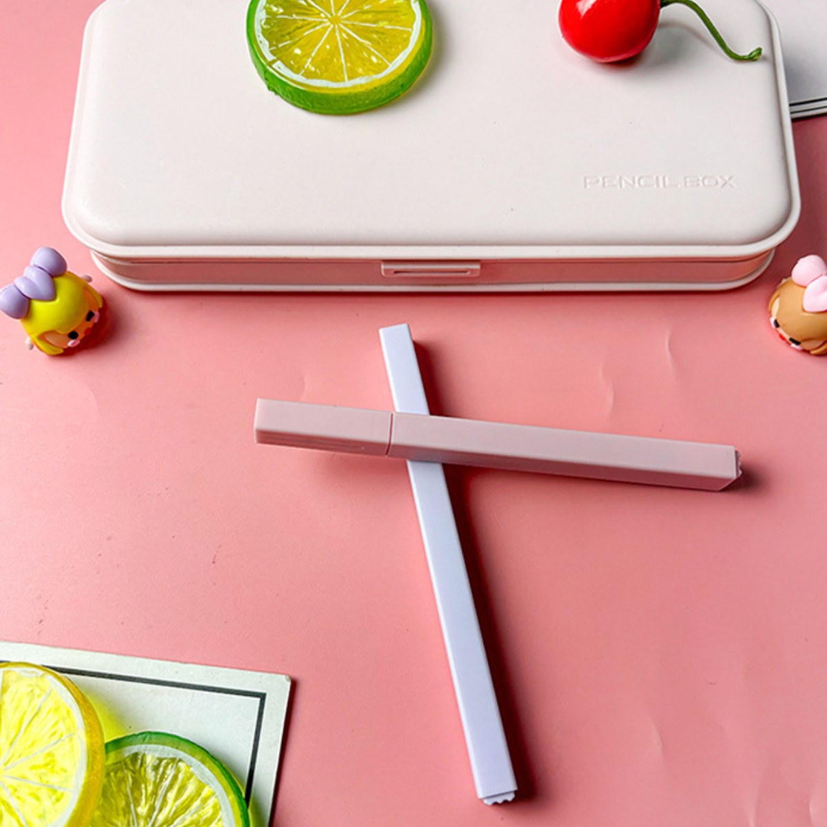 Two square-barrel highlighters crossed